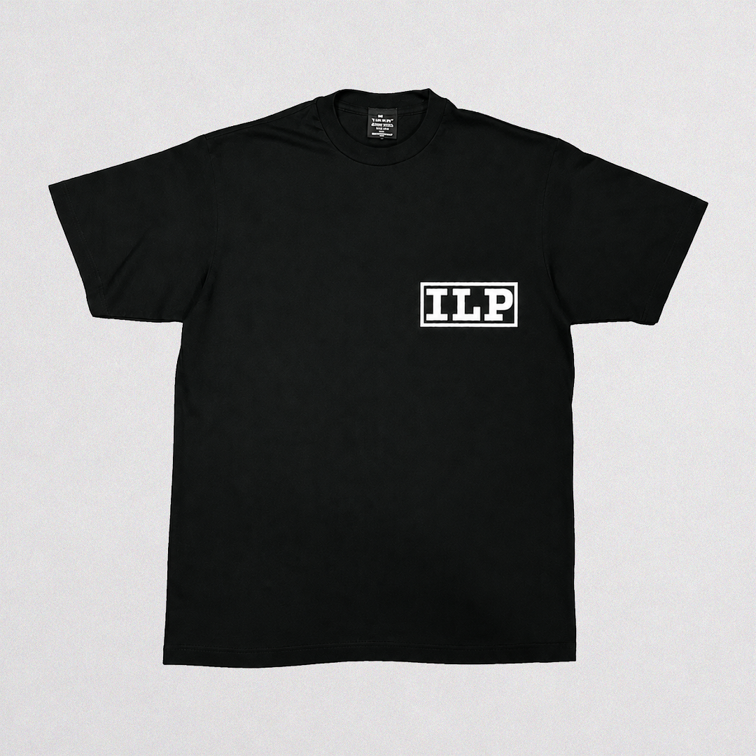 A black short-sleeve crewneck t-shirt with a white rectangular box logo containing the letters 'ILP' on the left chest, displayed flat against a light gray background.