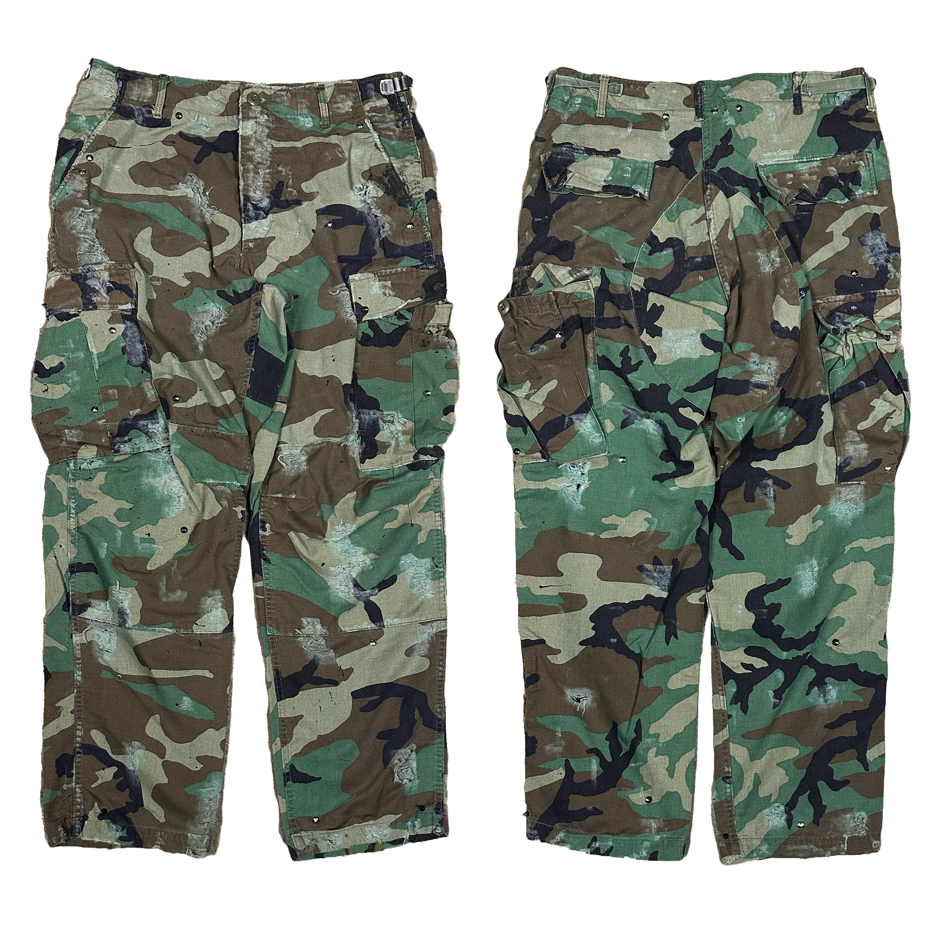 distressed with paint and studs Camouflage pants on a white background